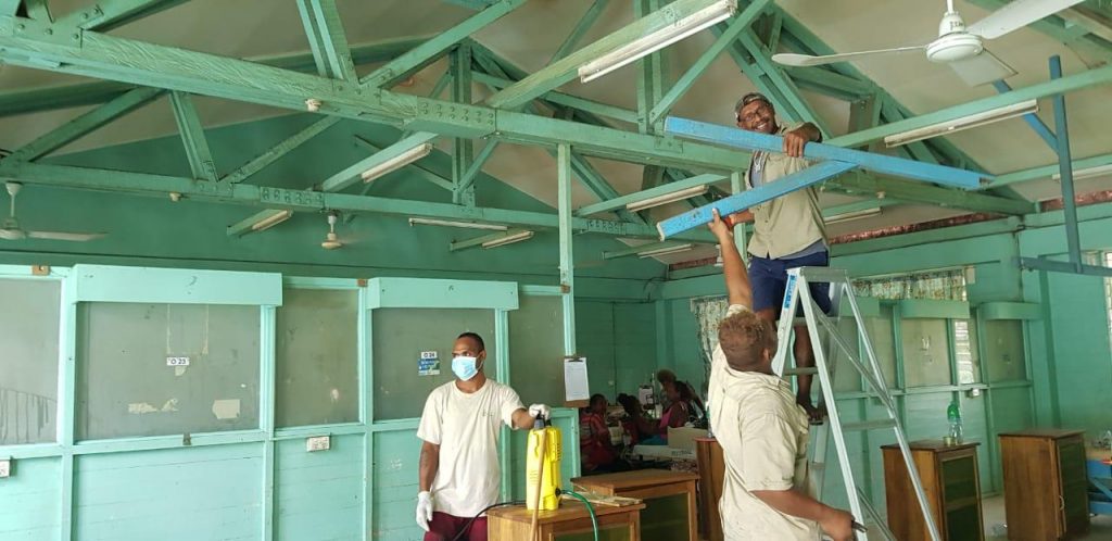 Orthopedics Staff cleaning the ceiling