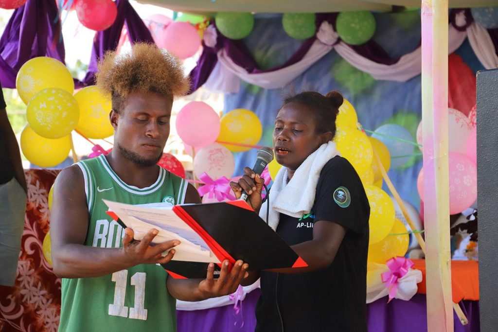 Kokona women splash out $100K from savings 5 Alice Kekevo the savings clubs Money Counter declares their finances during the event.