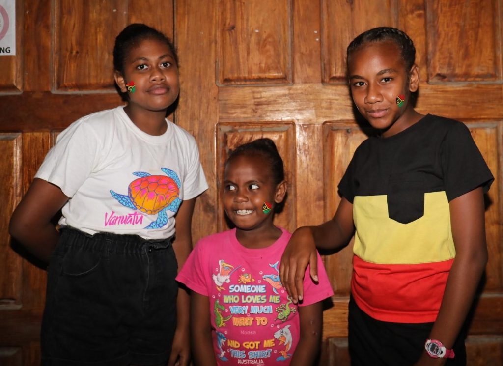 Children of Vanuatu Families displaying the Vanuatu flag on their cheeks