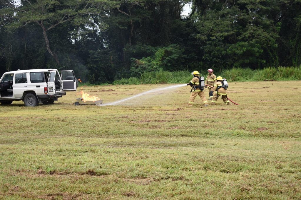 Fire and Rescue officers putting off a fire during the demonstration