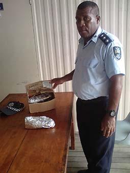 Operation manager Inspector Leleina with some of the confiscated marijuana.