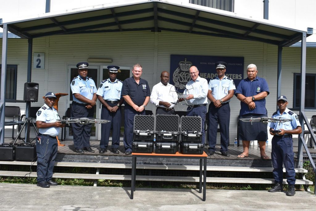 Australian High Commissioner Dr Strahan hands over the drones to Minister of Police Hon. Veke