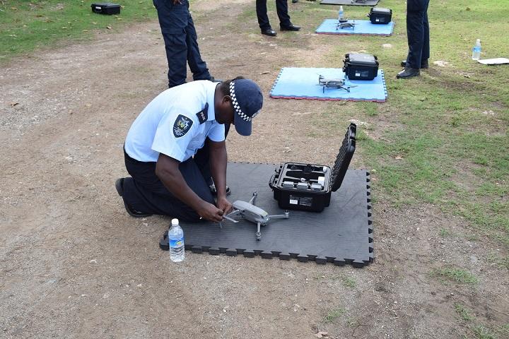 An officer sets up a drone