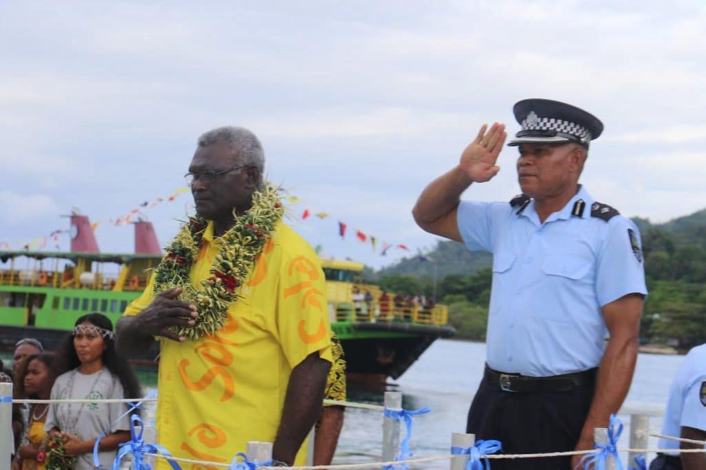 PM Sogavare embraces the national anthem during the welcome ceremony in Buala today