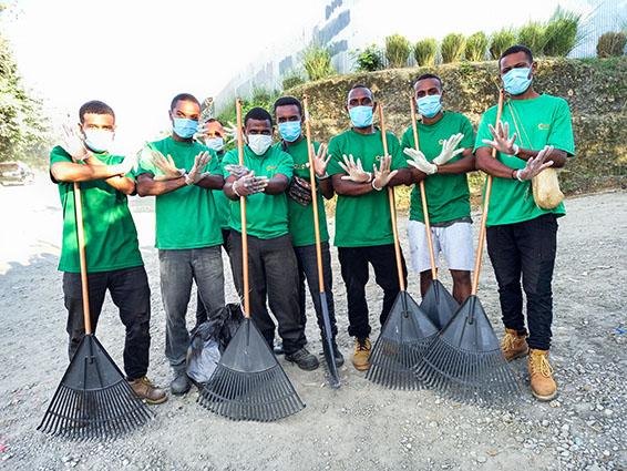 Photo 1 Don Bosco Technical Institute students take a stand for a cleaner future on the streets near Henderson on World Environment Day