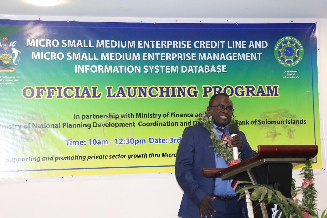 Guest of honour, Honourable Frederick Kologeto delivering a keynote address to officially open the MSME credit line and MSMEMIS Data base