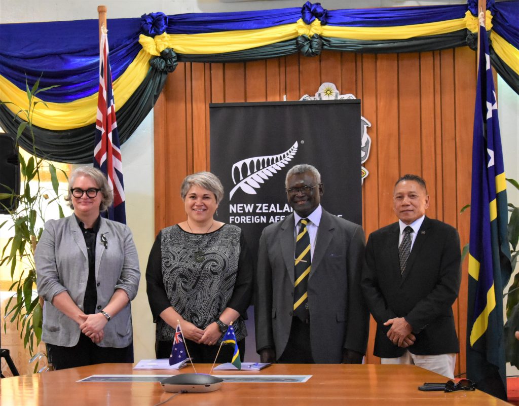 Acting Australian High Commissioner Sally Anne Vincent New Zealand High Commissioner Georgina Roberts Prime Minister Manasseh Sogavare and Minister Peter Shanel Agovaka after the contract signing. 1