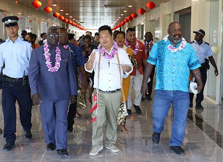 Mr Zheng taking the PM Guadalcanal premier and other invited guests for a tour around the new mall
