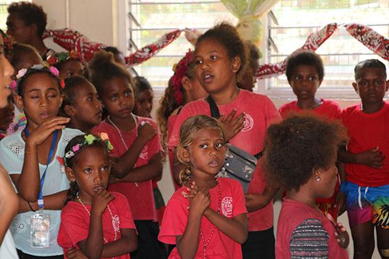 Children singing the National Anthem