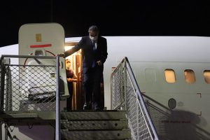 Minister Yi emerges from the plane at Honiara International Airport