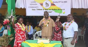 PM Sogavare (Center) and Minister of Finance and Treasury Honoarable Harry Kuma (Right) and President of Lauru Peoples' Association, Nanette Tutua. After cutting the Second Appointed Day cake.