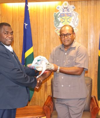 Speaker of the Vanuatu National Parliament Hon. Hon. Seoule Simeon presents a gift to Acting Prime Minister Manasseh Maelanga during a courtesy visit on Thursday 1 June