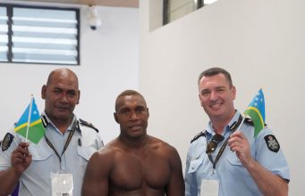 Royal Solomon Islands Police Force RSIPF Commissioner Mostyn Mangau and Australian Federal Police AFP Solomon Islands Commander Heath Davies giving Hency Charles moral support during the event