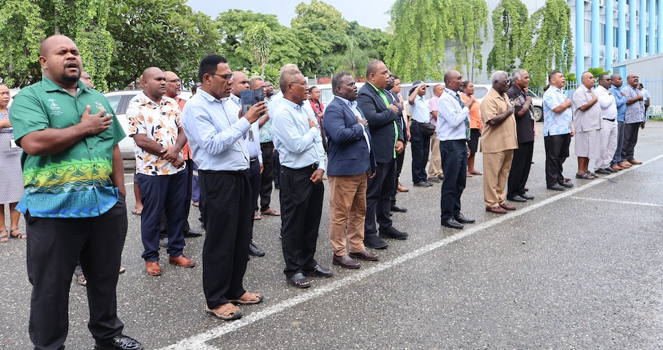 PSs, DSs joint the caretaker PM and OPMC Officials in this morning's national anthem singing and flag raising ceremony.
