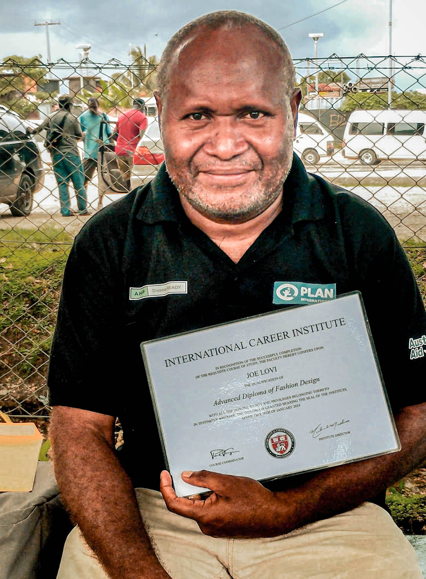 Smiling with pride Joe Lovi holds his hard-earned Advanced Diploma in Fashion and Design from the International Career Institute, signifying the next chapter in his exciting journey into the world of fashion